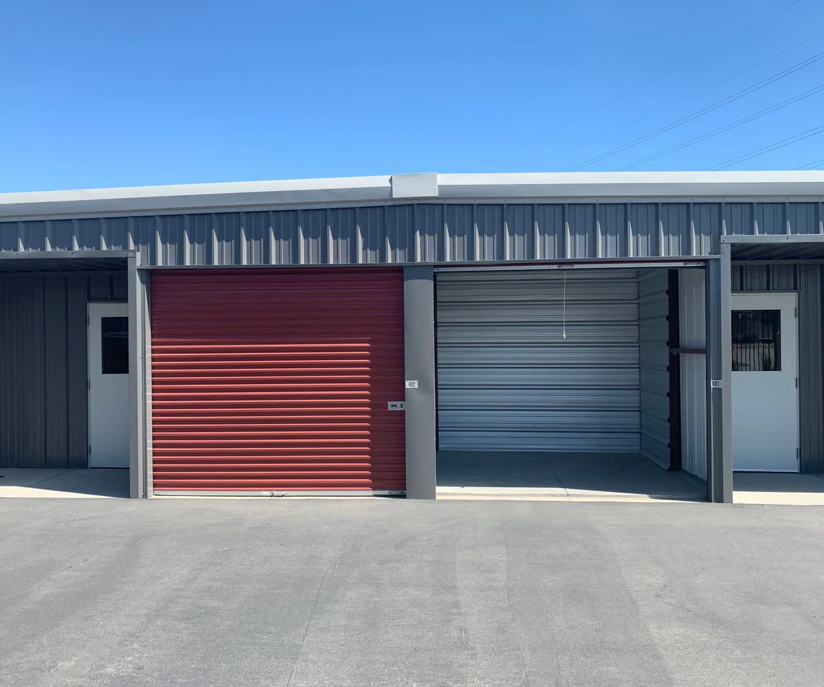 Small pre-engineered metal building with a clear-span drive-in bay and standing-seam steel roof