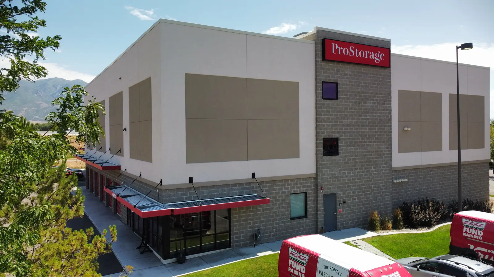 Multi-story Pro Storage steel self-storage building in Layton, Utah, with the Wasatch behind